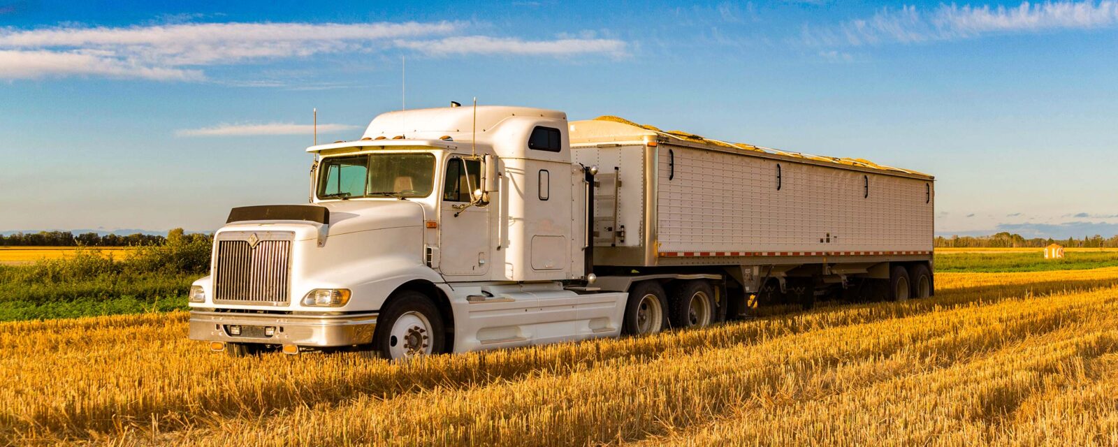 Farm Trucks Hauling. Farm Equipment Shipping Company.