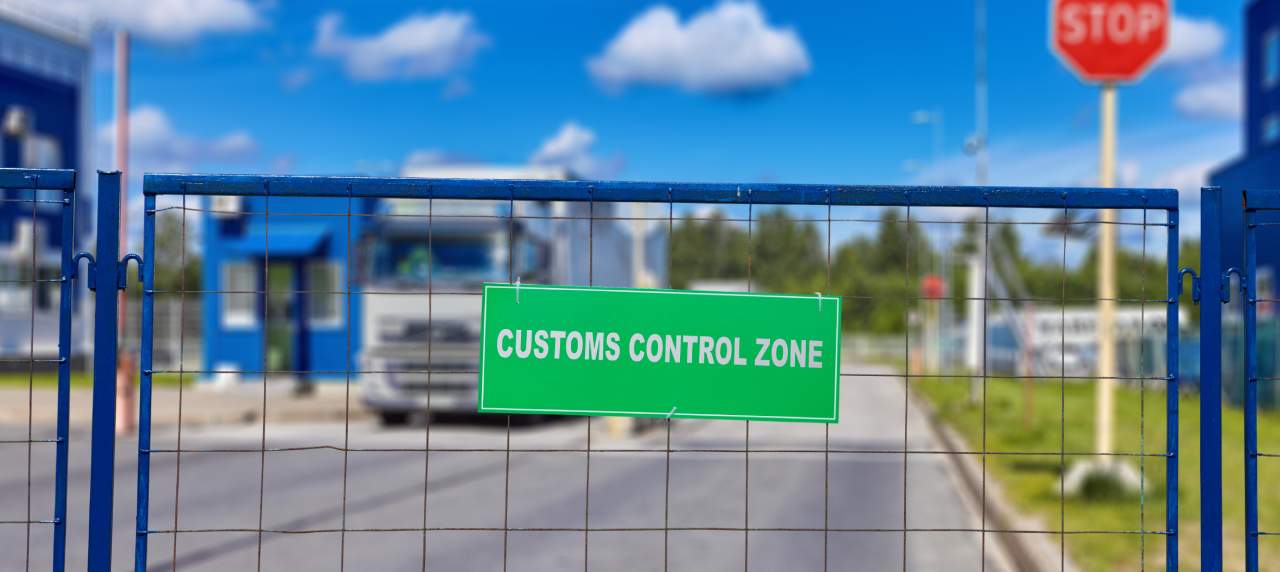 Customs control zone sign on the gate