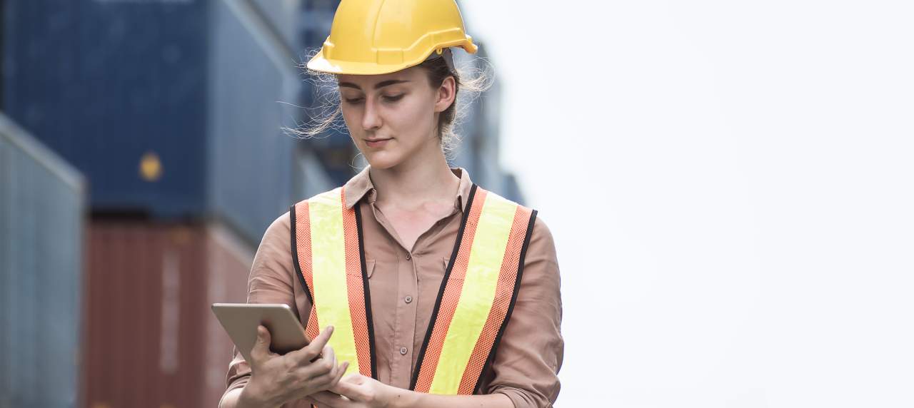 Port worker checking information in the tablet